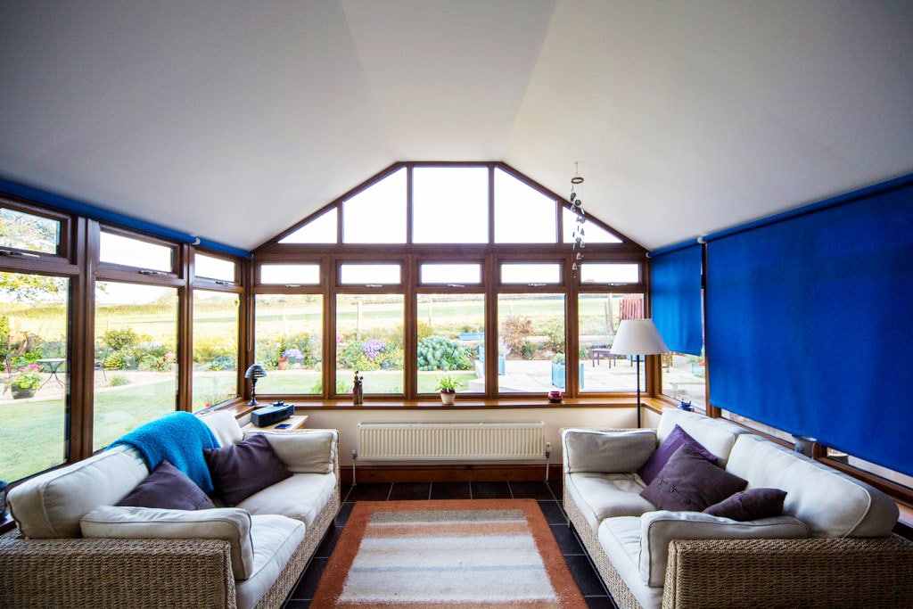 Bright interior of a home with a Leka conservatory roof creating a comfortable living space