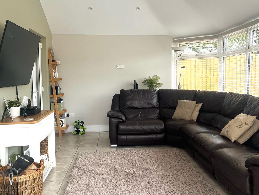 Interior view of a conservatory transformed into a comfortable living area