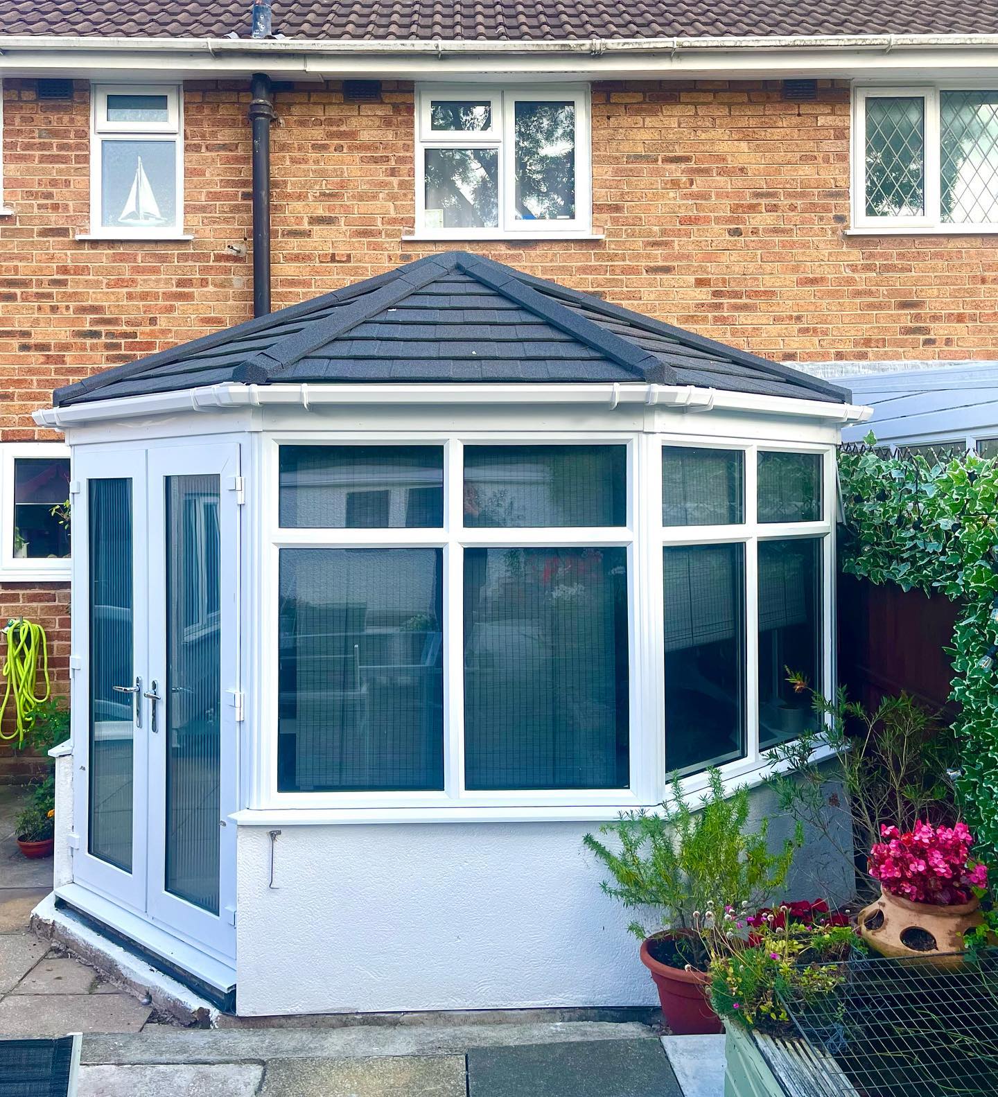 Modern house exterior with Guardian warm roof conservatory system