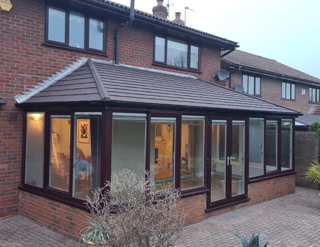 Comfortable living room space created by a conservatory roof replacement